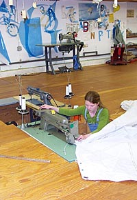 Loft worker at sewing machine